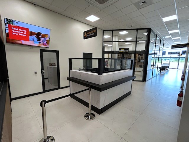 The wall-mounted advertising screen beside the EAG check-in desk