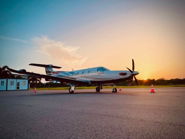 A Pilatus PC-12 on the EAG apron at sunset