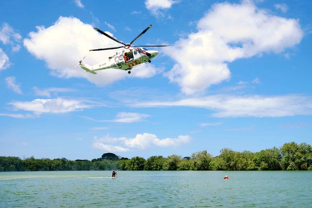An offshore helicopter airborne over the coastal water near Paramaribo